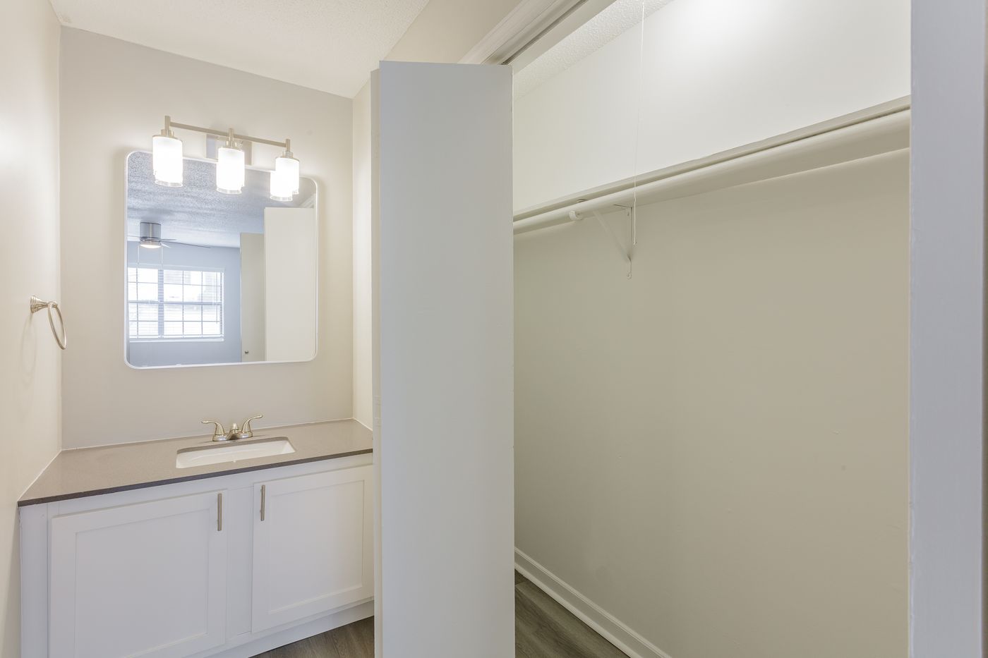 Bathroom vanity and walk-in closet